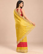 Yellow bandhani tissue silk saree - back view showing open back blouse