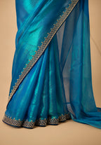 Ocean Blue Metallic Satin Festive Saree with Navy Blue Velvet Embroidered Blouse