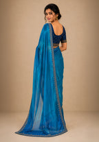 Ocean Blue Metallic Satin Festive Saree with Navy Blue Velvet Embroidered Blouse